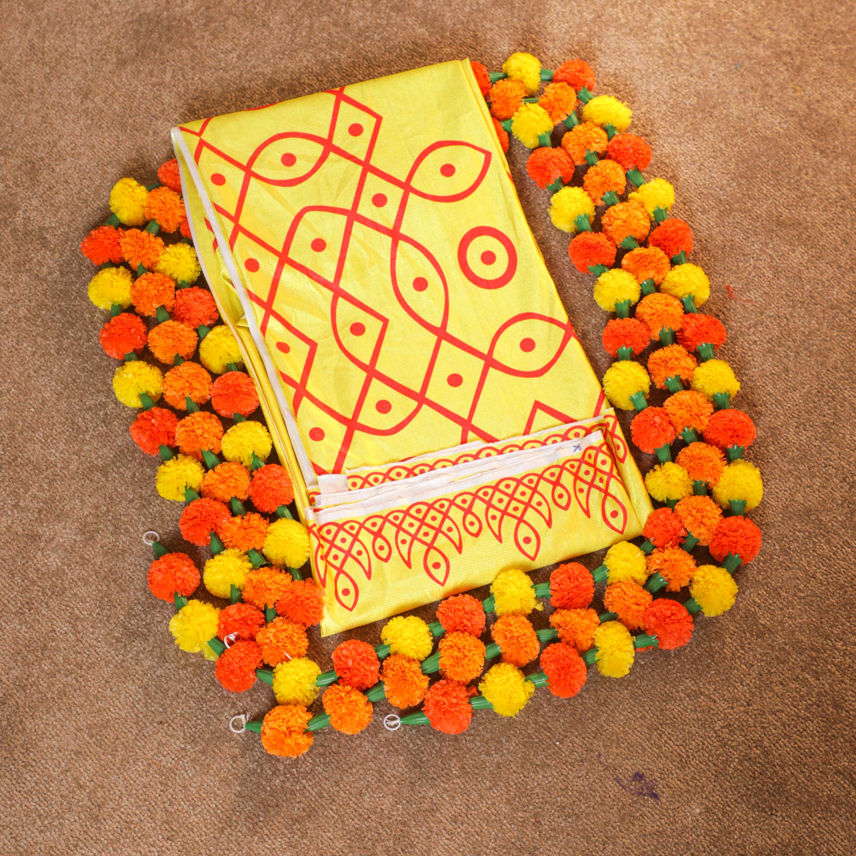 set of yellow backdrop cloth with garlands for pooja